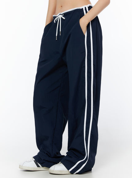 wide-leg-stripe-track-pants-iu516 / Dark blue
