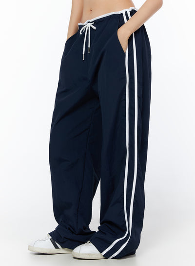 wide-leg-stripe-track-pants-iu516 / Dark blue