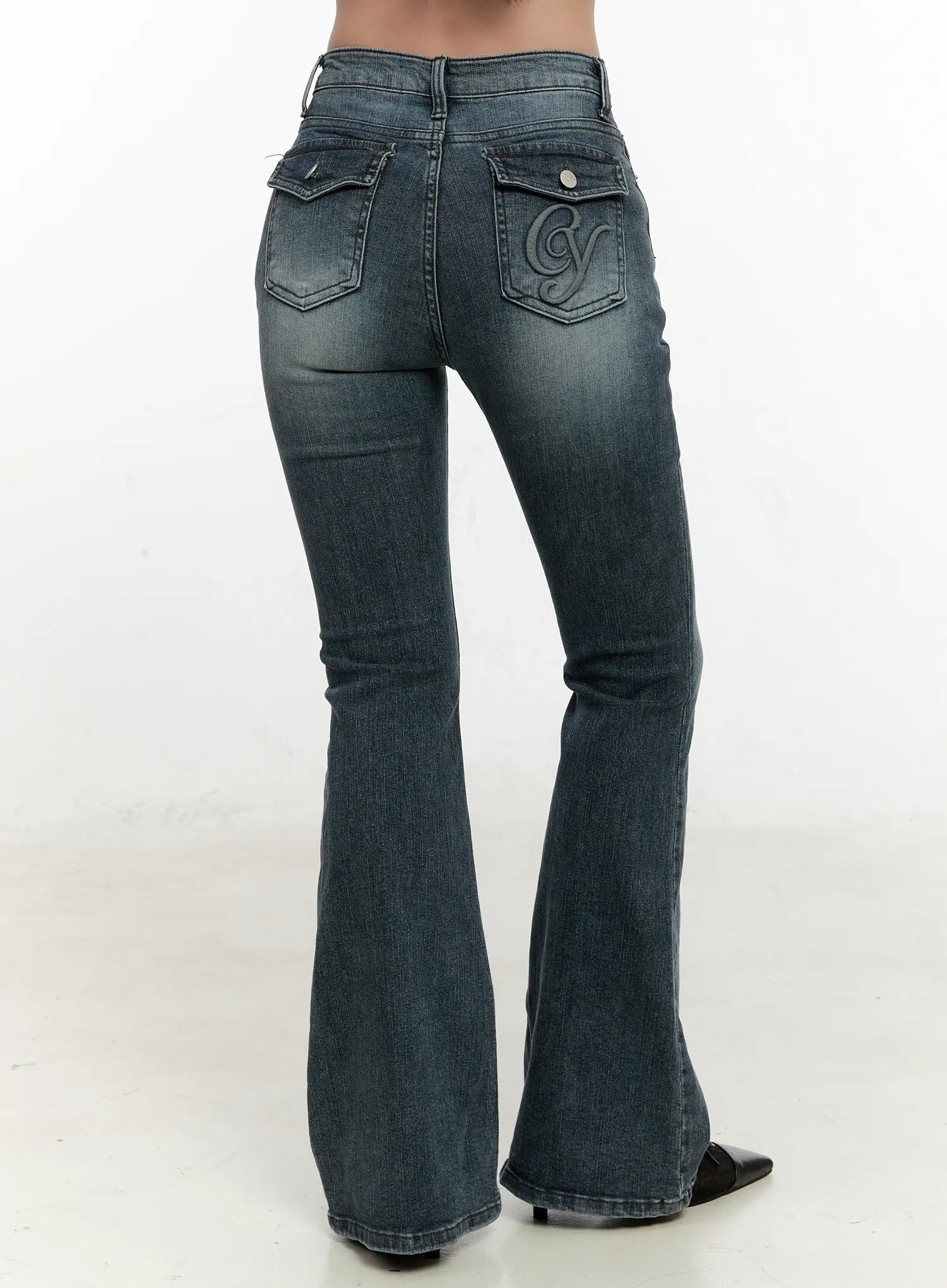 LEWKIN Marley Hip-Pad Denim Bootcut Jeans CN506 in dark blue, back headless close-up on model, slim bootcut silhouette with embroidered logo pocket and snap-button flap, washed cotton-spandex denim.