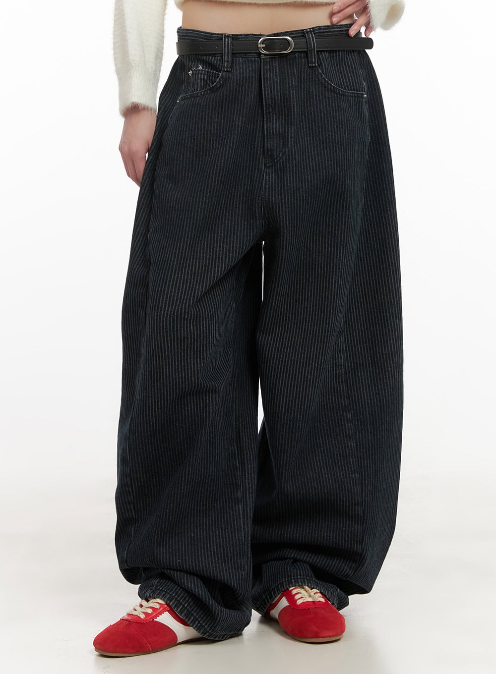 LEWKIN Comfortable Striped Wide-Leg Pants CD425 in dark blue, front cropped view on model, oversized wide-fit cotton with vertical stripe texture, belted waist, paired with white sweater and red sneakers.