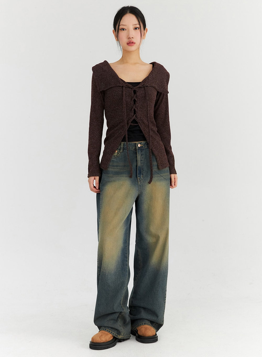 LEWKIN Washed Wide Leg Jeans CN315 in dark blue, full-length front view on model, wide-fit cotton denim with vintage yellow-tinted wash, paired with brown lace-up knit top and tan mules.