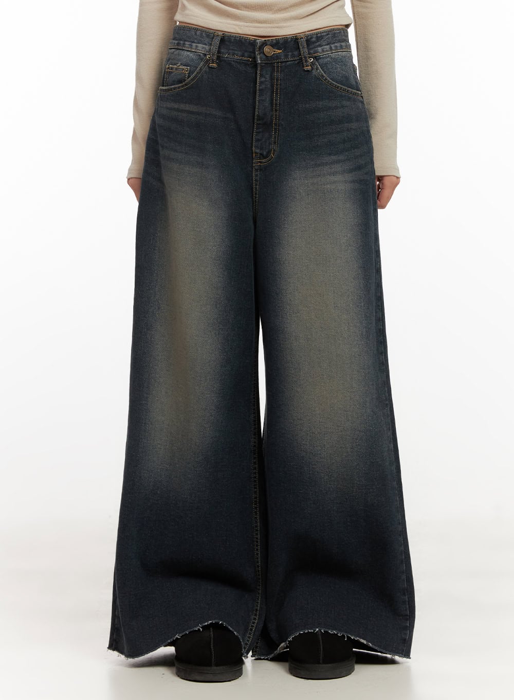 LEWKIN Tasha Low Waist Washed Wide Leg Jeans CD410 in dark blue, front view on model, low-rise cotton denim with washed fading, ultra-wide leg silhouette, raw-hem cuffs, paired with beige long-sleeve top.