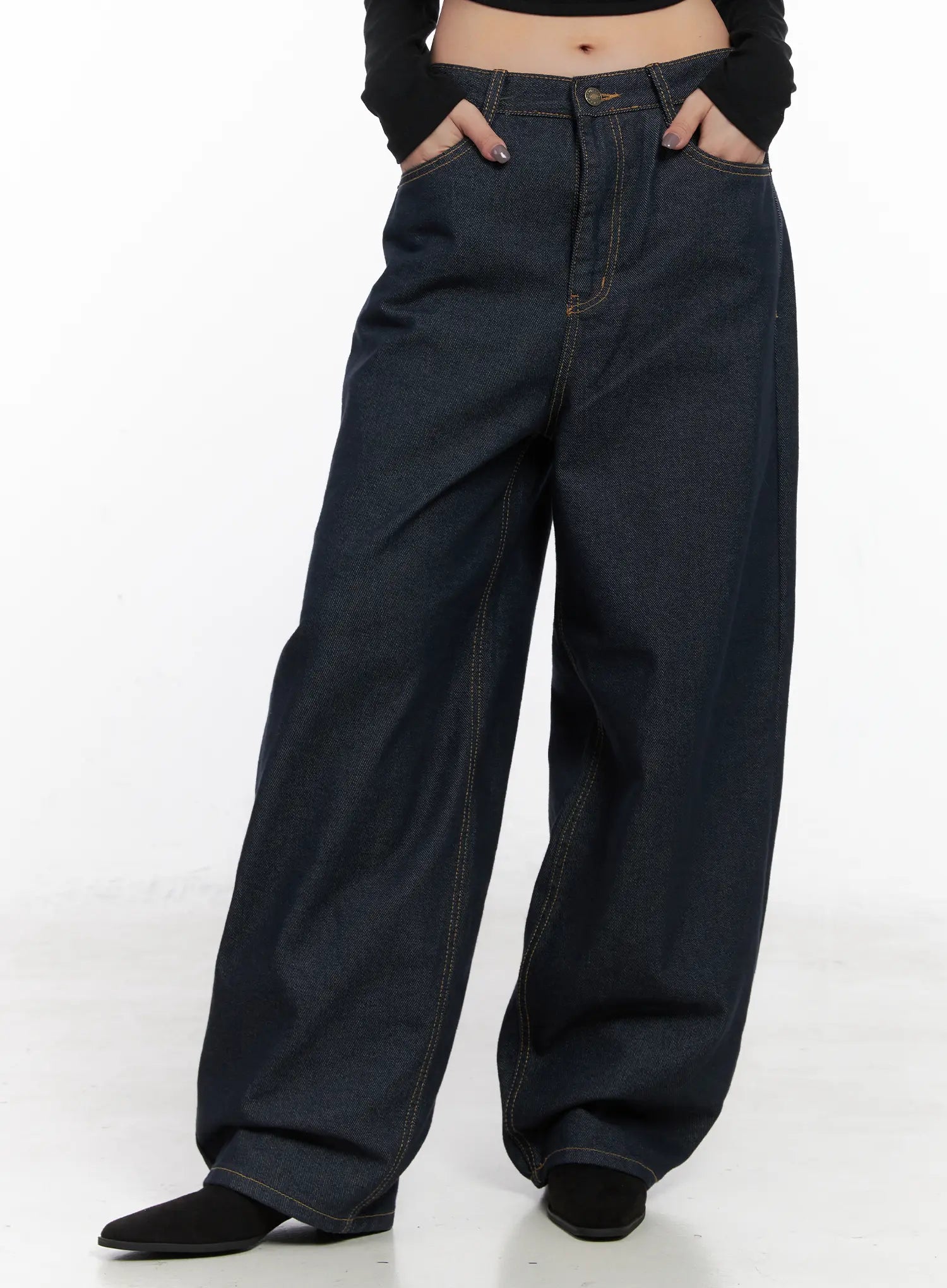 LEWKIN Heaven Wide-Leg Dark Washed Jeans CN513 in dark blue, front cropped view on model, hands in pockets, wide-fit cotton denim with contrast stitching, paired with black long-sleeve top.
