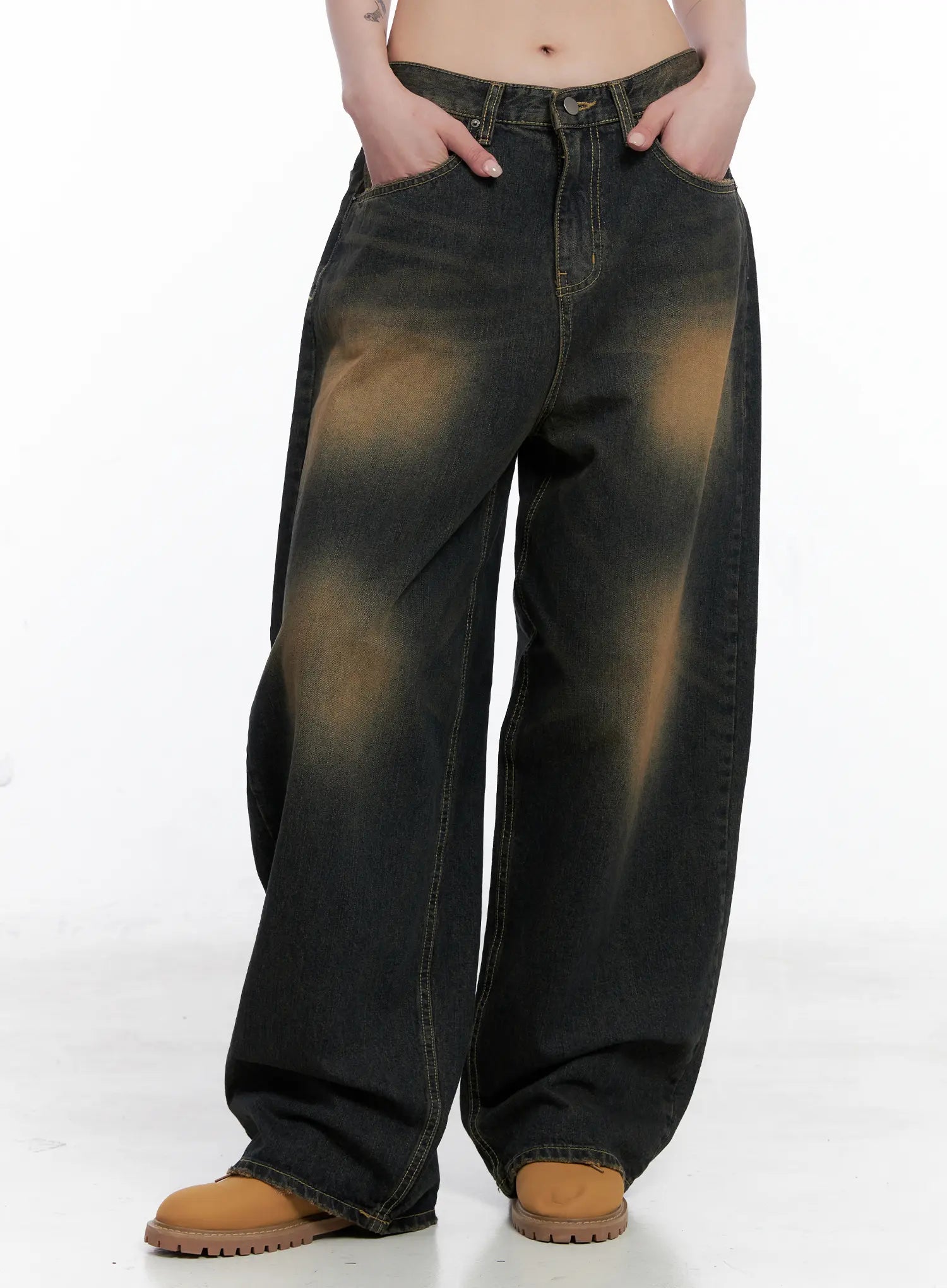 LEWKIN Leona Vintage Baggy Jeans CS526 in dark blue, front crop view on model, wide-leg cotton denim with amber washed fade, hands in pockets, paired with tan boots.