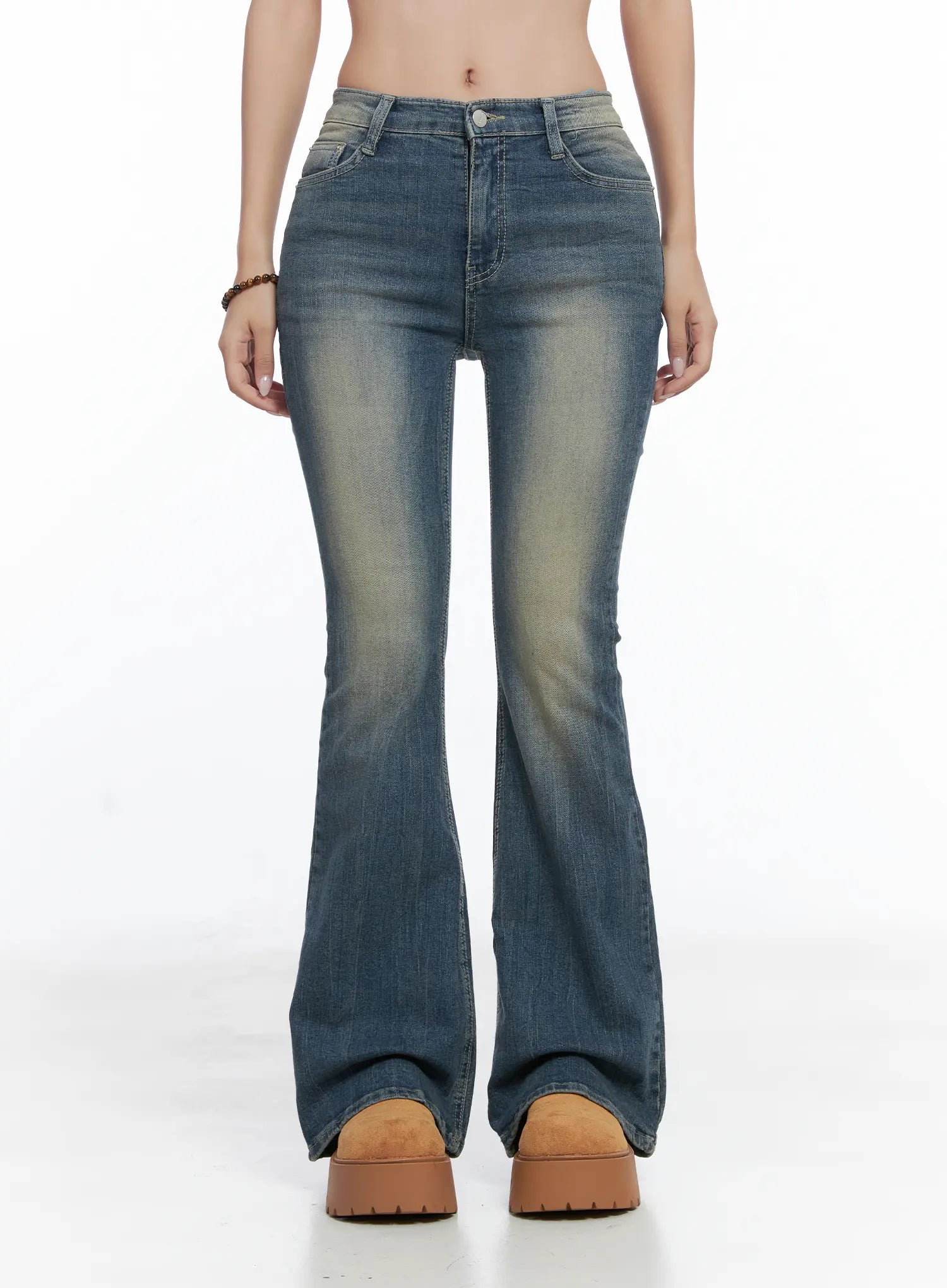 LEWKIN Sloan Vintage Hip Pad Flare Jeans CS502 in dark blue, front product shot on model, cropped waist-to-hem view, slim fit with washed fading, flare hem pooling over chunky platform shoes.