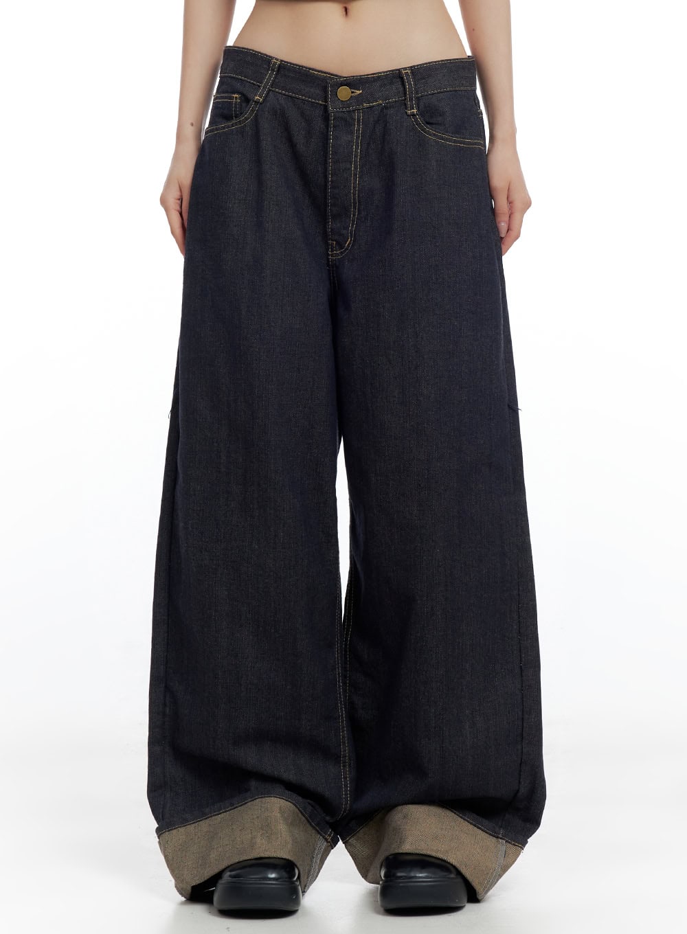 LEWKIN Sadie Roll-Up Denim Jeans CO426 in dark blue, front mid-shot on model, wide-fit baggy cotton denim with contrast khaki roll-up hem and gold contrast stitching, low rise.