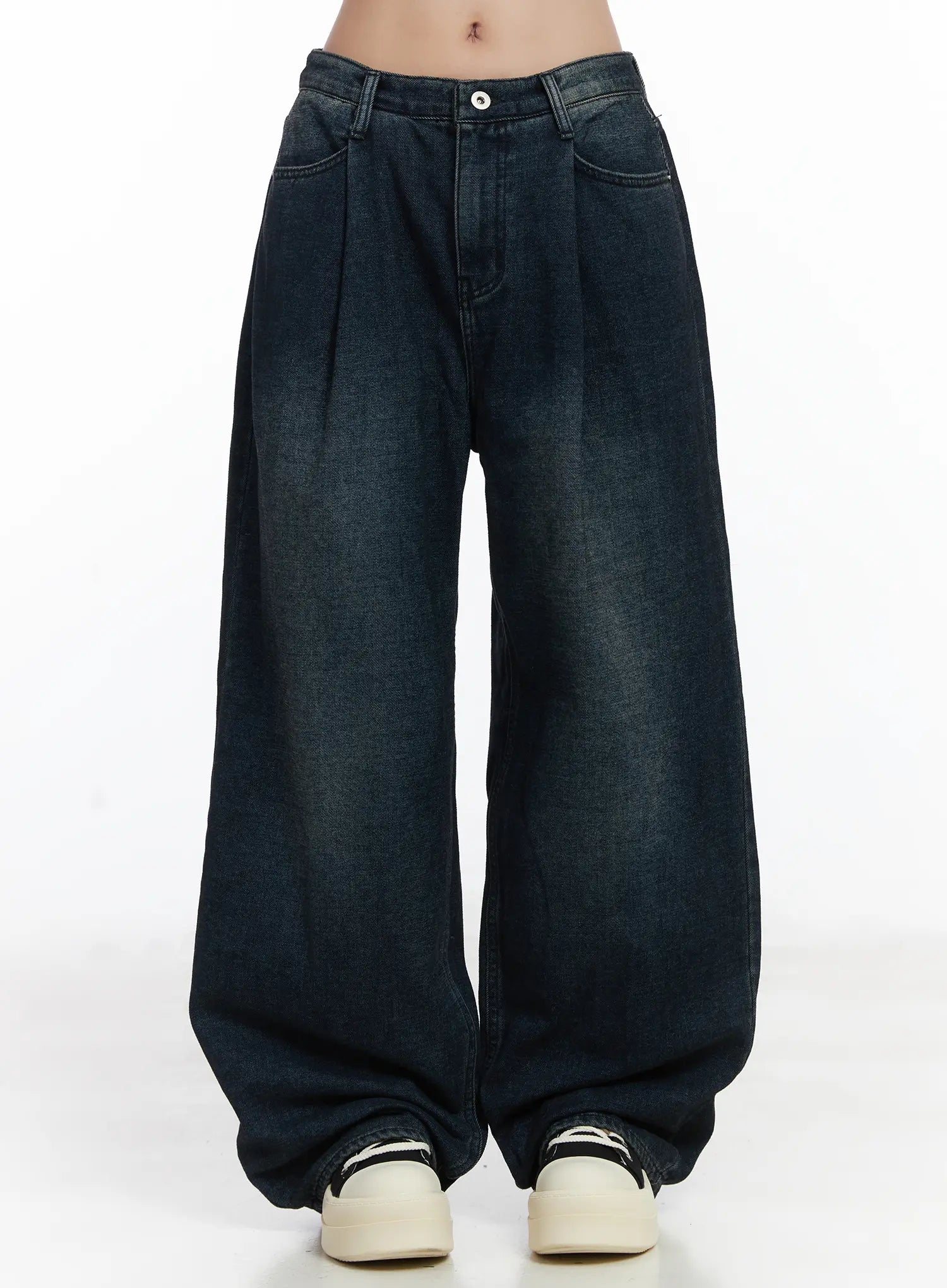 LEWKIN Lettie Fleece Pintuck Wide Leg Jeans CD529 in dark blue, front product shot on model from waist down, washed cotton wide-fit with pintuck pleats, paired with chunky sneakers.