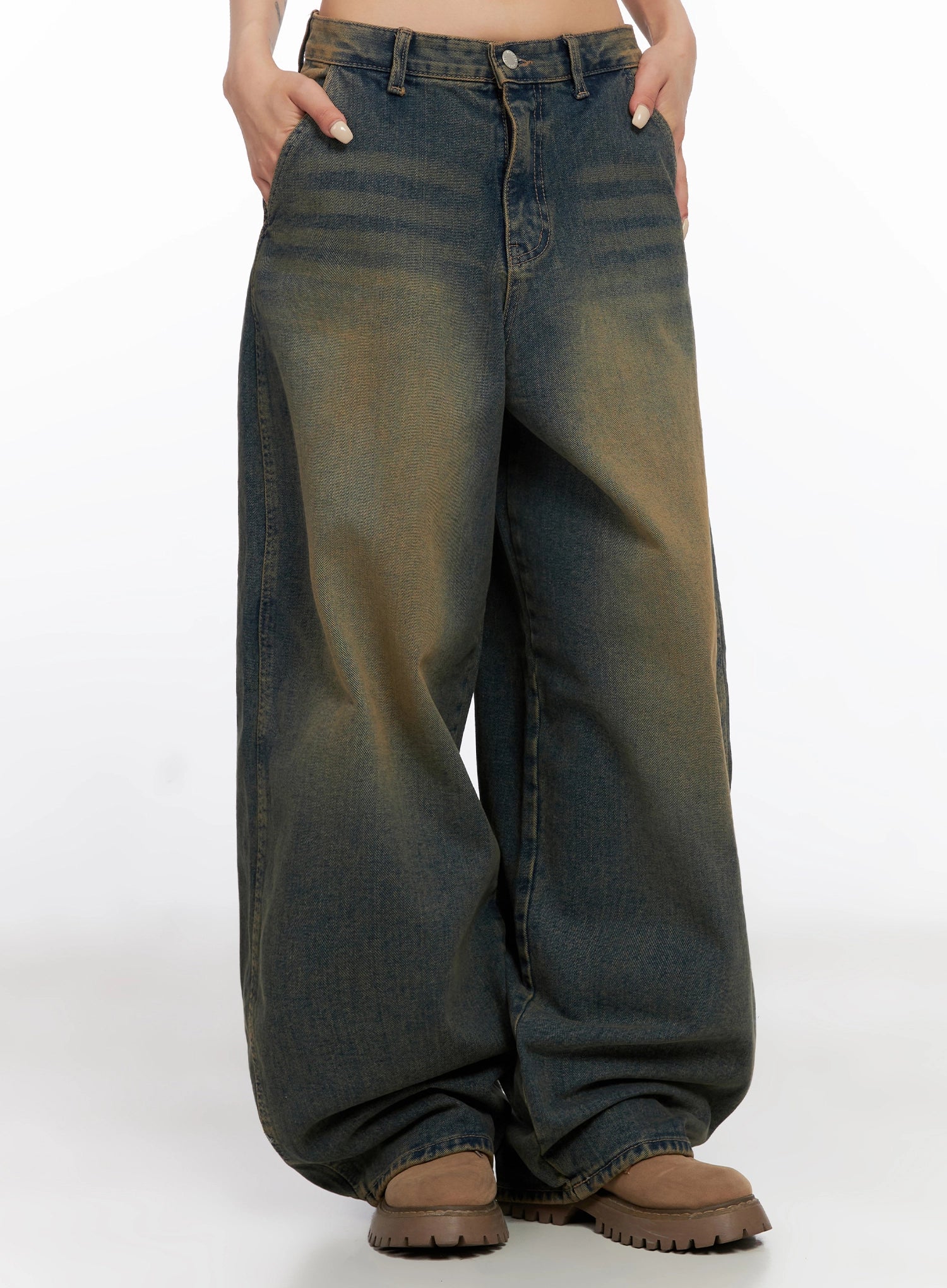 LEWKIN Minju Vintage Washed Baggy Jeans IS508 in dark blue, front mid-shot on model, ultra-wide baggy cotton denim with yellow-tinted wash, low rise, paired with brown chunky boots.