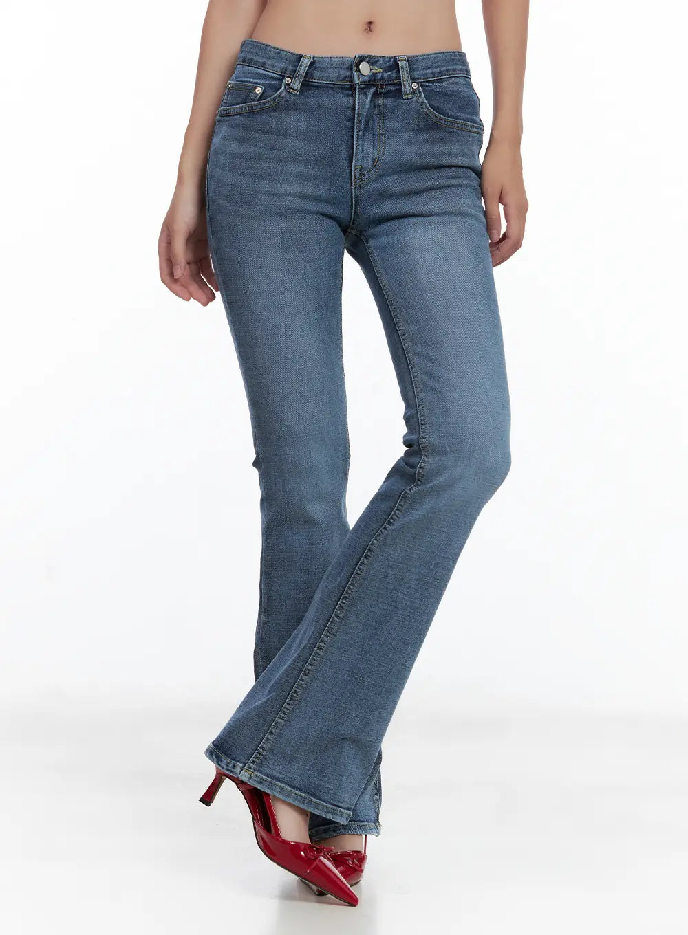 LEWKIN Beni Washed Flared Denim Jeans CL508 in dark blue, front three-quarter view on model, mid-rise bootcut with washed finish, paired with red patent heels.