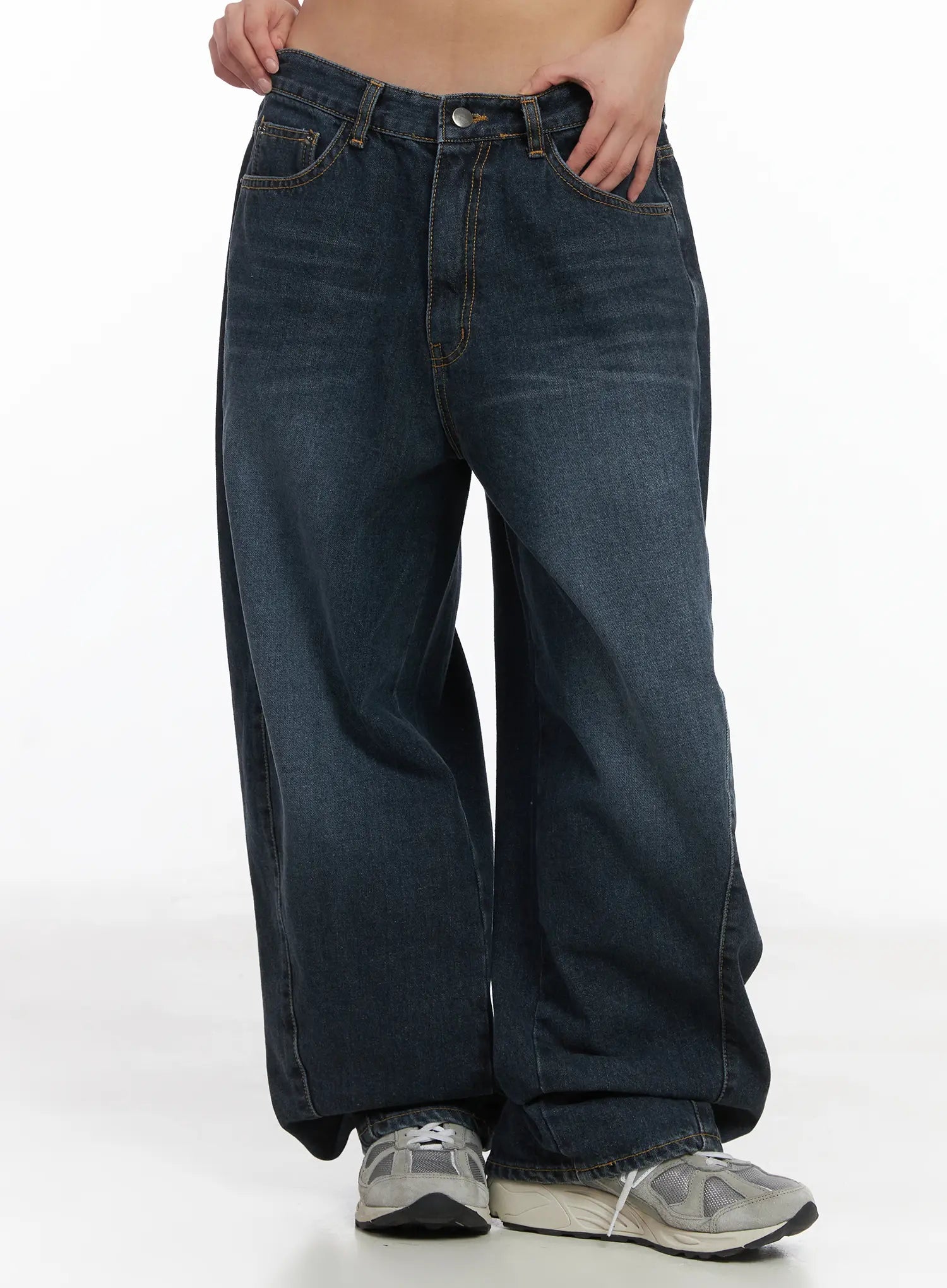 LEWKIN Everly Wide Leg Jeans CJ513 in dark blue, front close-up on model, washed cotton wide fit with five-pocket styling and contrast stitching, paired with grey sneakers.