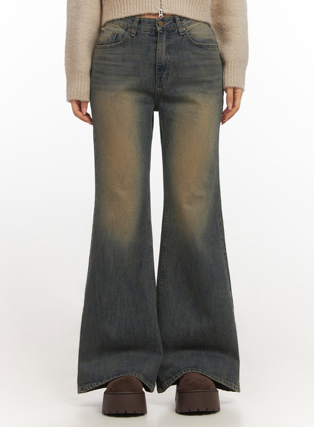LEWKIN Kourtney Vintage Wash Flared Jeans IF510 in dark blue, front waist-to-hem shot on model, slim-fit flared cotton denim with amber vintage wash, paired with beige knit and brown platform boots.