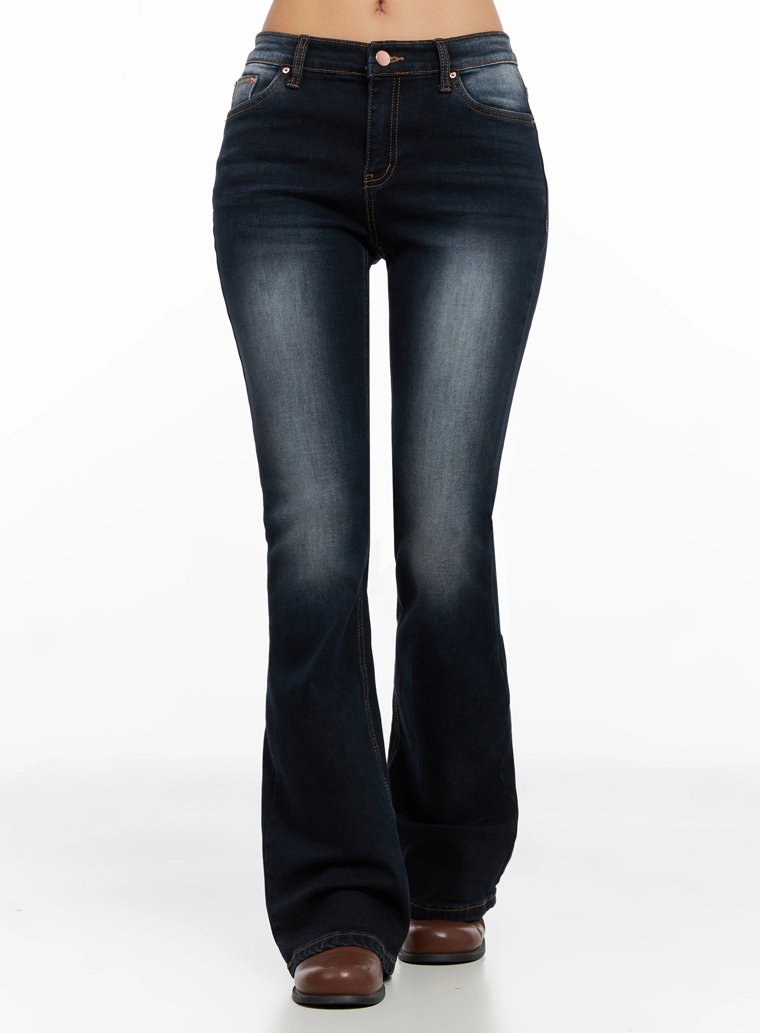 LEWKIN Aliyah Mid-Rise Hip Pad Flared Jeans IG528 in dark blue, front full-length model shot, slim-fit washed cotton flare leg with contrast stitching, paired with brown leather boots.