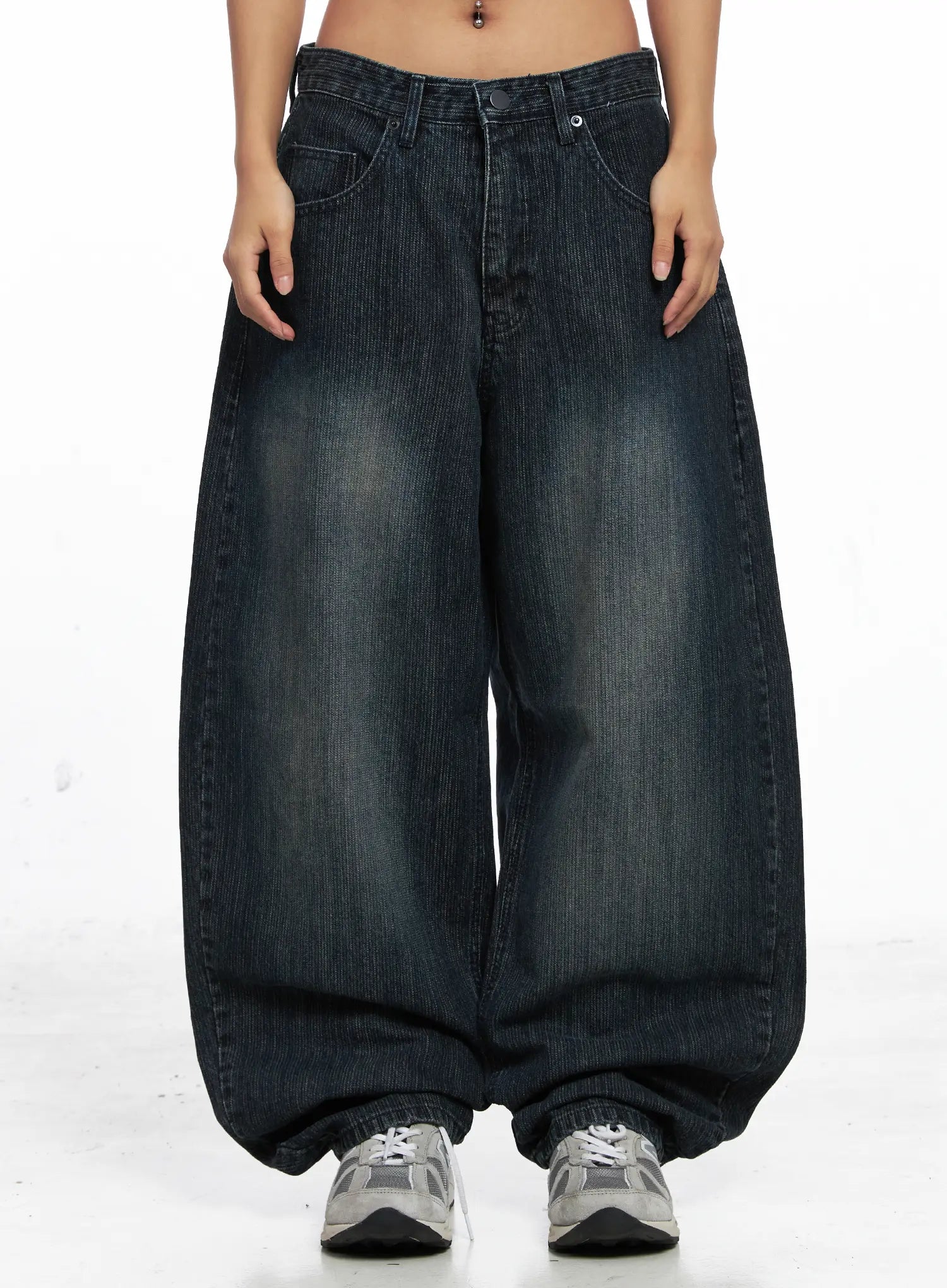 LEWKIN Aspyn Wide-Leg Washed Corduroy Jeans CO510 in dark blue, front crop view on model, ultra-wide cotton corduroy with washed fading, front pockets, pooling hem over sneakers.