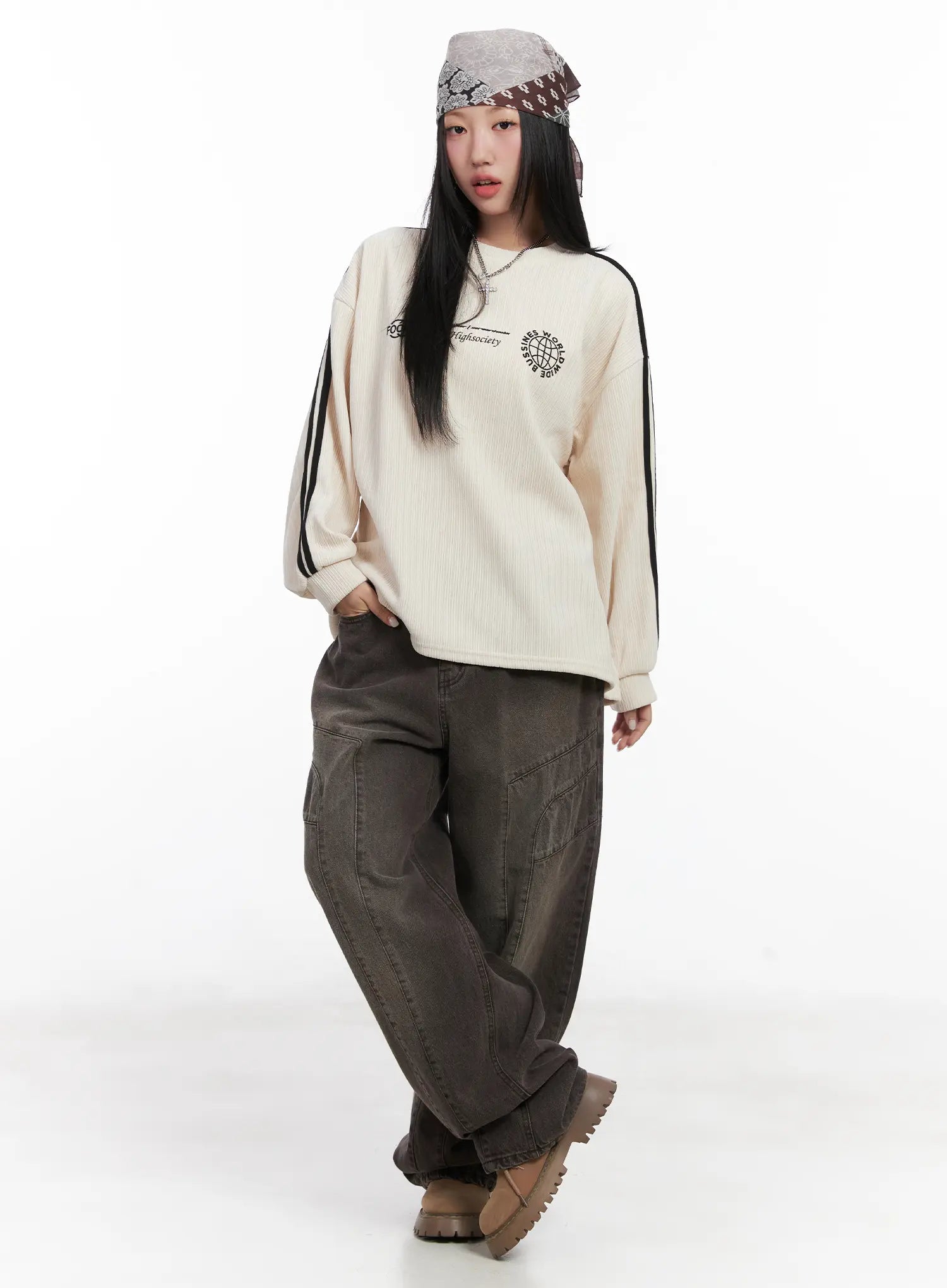 LEWKIN Elia Washed Baggy Jeans CN528 in dark brown, full-length front shot on model standing, wide-fit washed cotton with cargo pockets, styled with cream striped sweatshirt and chunky boots.