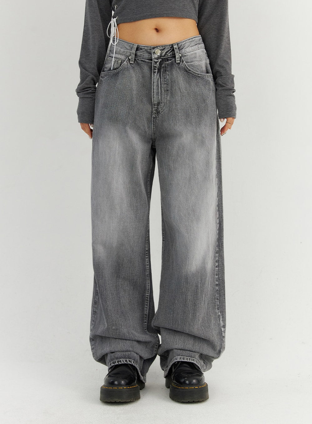 LEWKIN Grey Washed Wide Leg Jeans CO323 in Gray (1XL), front waist-down crop on model, low-rise wide cotton denim with faded wash, paired with gray crop top and black chunky boots.