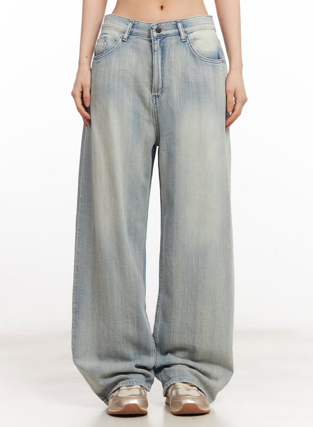 LEWKIN Jessi Washed Wide-Leg Jeans CA514 in light blue, front product shot on model, low-rise wide fit with faded wash, five-pocket styling, paired with metallic sneakers.