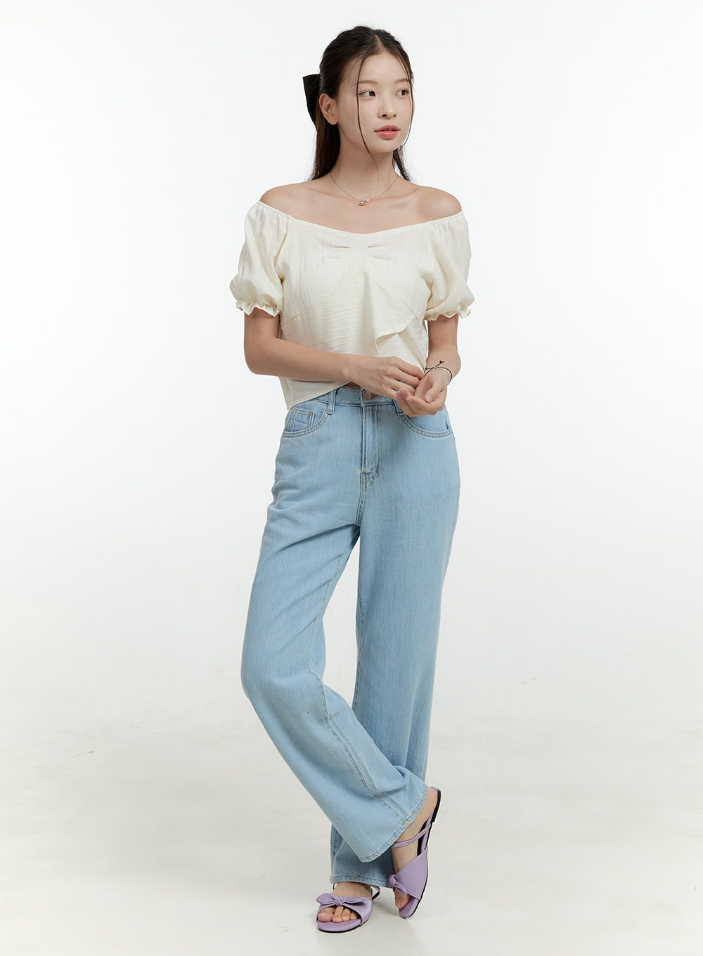 LEWKIN Ava Light Washed Straight Jeans OL430 in light blue, full-length 3/4 angle on model, wide-fit high-rise denim with light wash, styled with cream off-shoulder top and lavender bow sandals.