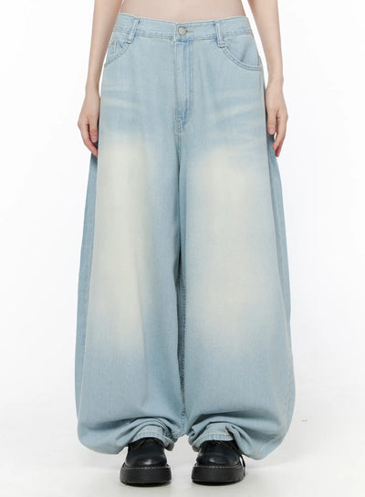 LEWKIN Ozzy Washed Wide Leg Jeans CU519 in light blue, front view on model, ultra-wide silhouette with faded wash, five-pocket styling, pooling hem over black loafers.