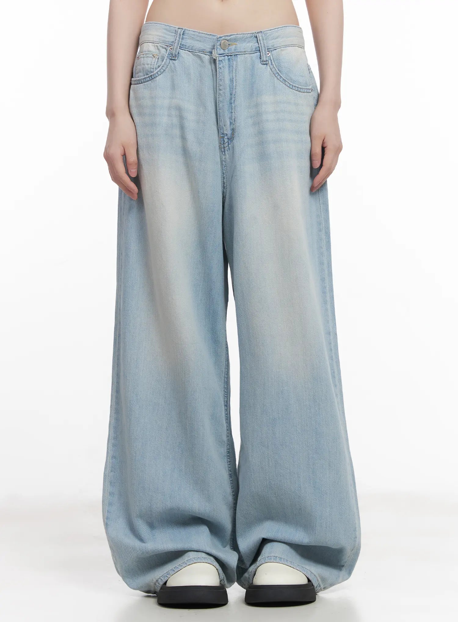 LEWKIN Garam Washed Wide-Leg Jeans CU518 in light blue, front product shot on model, baggy wide-leg cotton denim with washed fade, low rise waist, paired with slides.