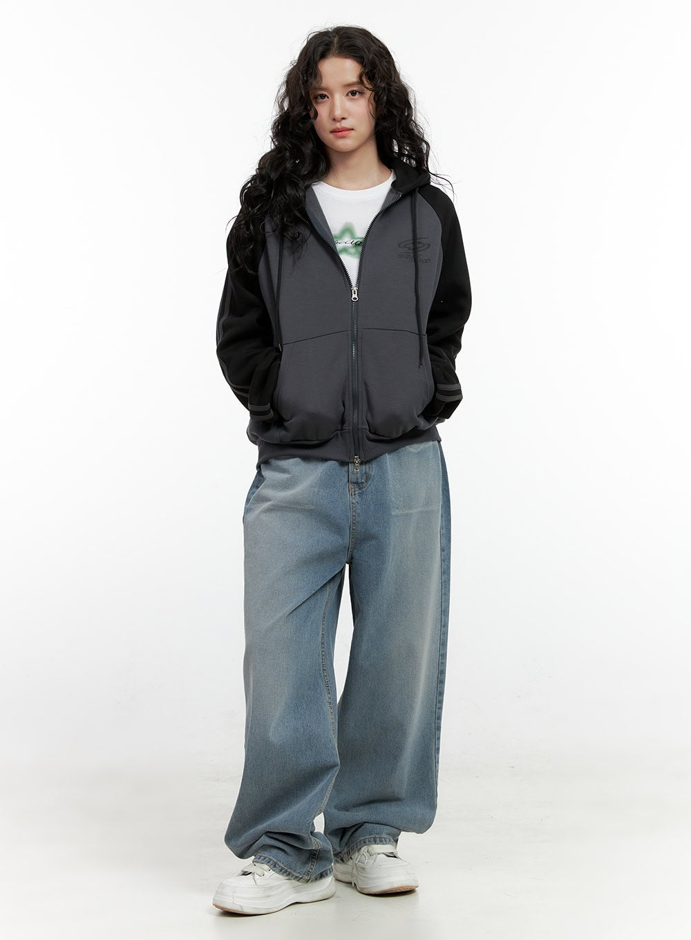 LEWKIN Taryn Chic Wide-Leg Jeans ON404 in light blue, full-body front shot on model, baggy washed denim with extra-wide leg, styled with grey zip-up hoodie and white sneakers.