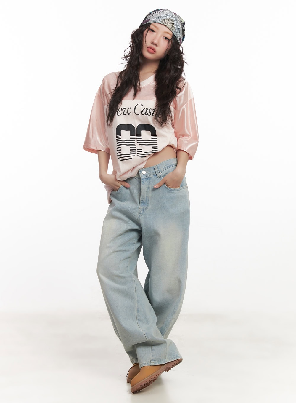 LEWKIN Alia Washed Wide-Leg Jeans CA518 in light blue, full-body front on model standing relaxed, ultra-wide washed denim with sun-faded finish, paired with pink graphic tee and chunky boots.