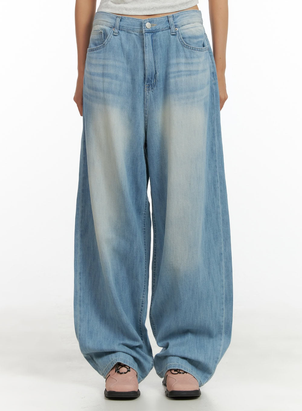 LEWKIN Washed Comfort Baggy Jeans CU414 in light blue, front waist-to-hem crop on model, wide-fit washed cotton denim with faded wash detail, paired with pink mules.