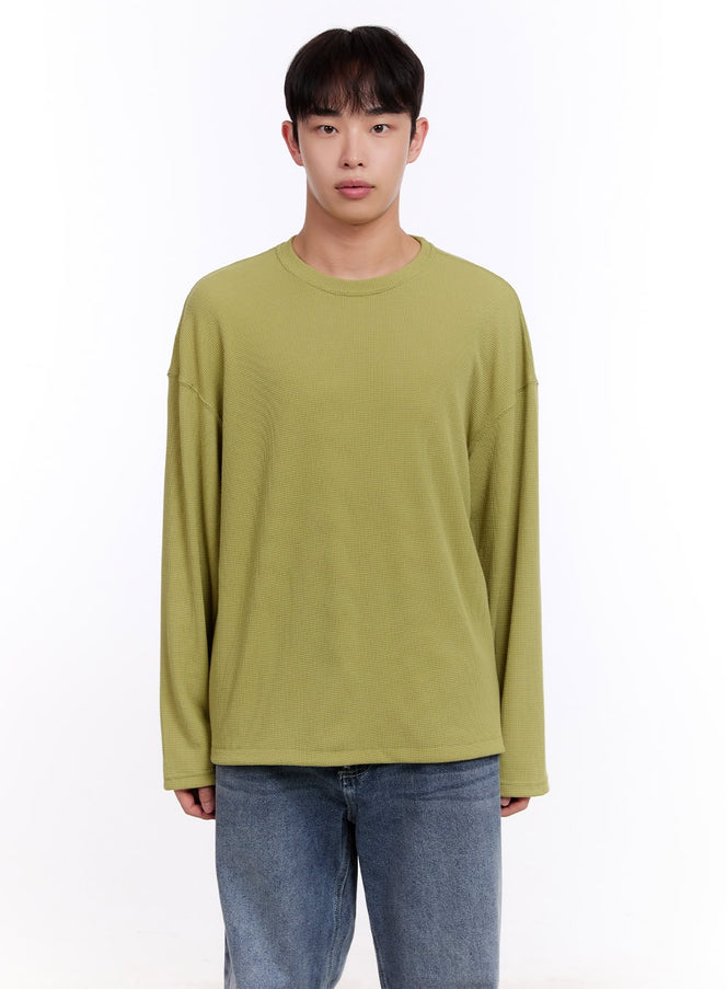 LEWKIN Men's Oversized Waffle-Knit Long Sleeve Tee IM512 in light green, front close-up on model, waffle-knit texture, drop shoulder, crew neck, paired with blue jeans.