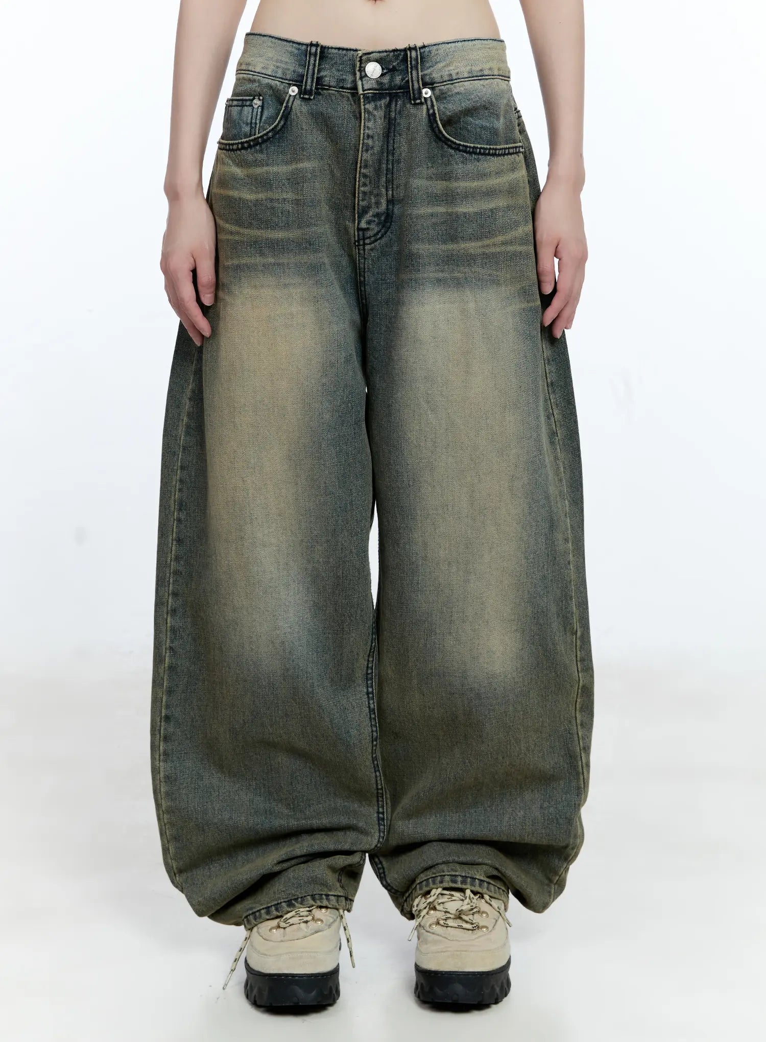 LEWKIN Yeonsoo Vintage-Wash Wide-Leg Jeans CG507 in vintage blue, front view on model, oversized wide-leg cotton denim with yellow-tinted wash, paired with chunky sneakers.