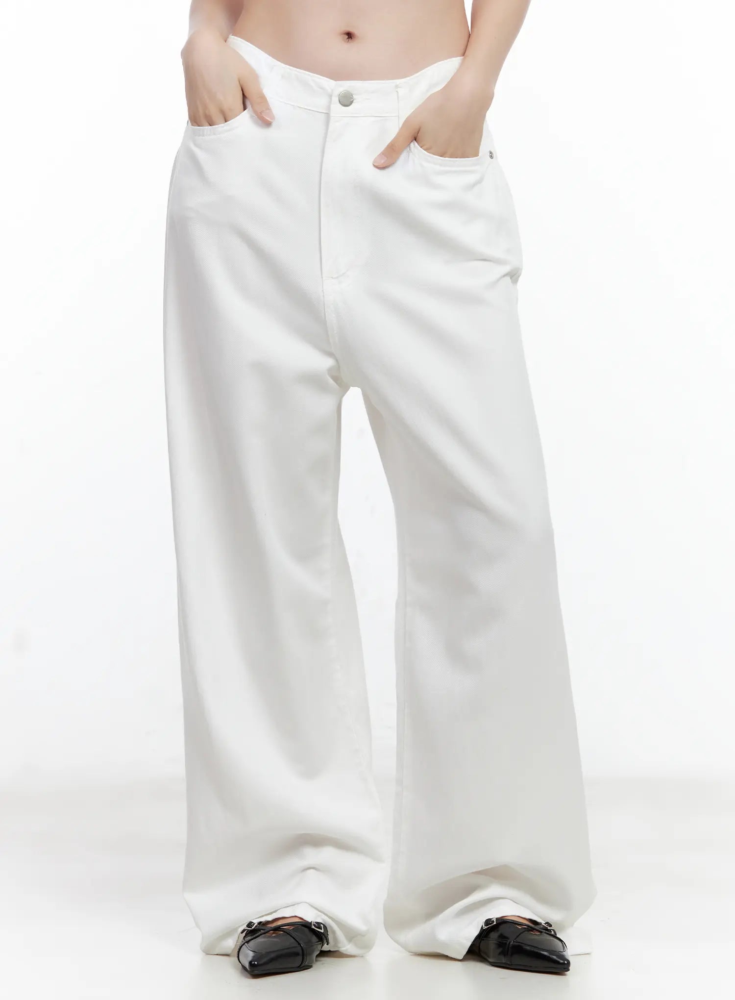 LEWKIN Jennie Baggy Wide-Leg Jeans CL502 in white, front close-up on model, hands in pockets, low-rise waistband with button, ultra-wide cotton leg, paired with black loafers.