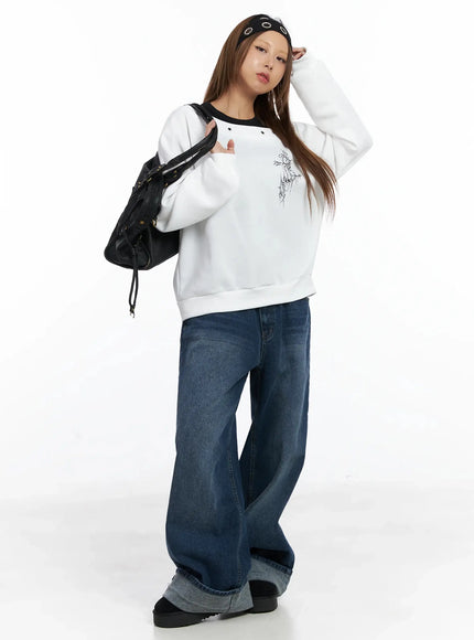 off-shoulder-eyelet-graphic-sweater-in528 / White