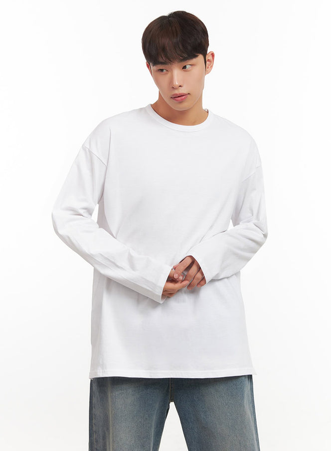 LEWKIN Men's Essential Oversized Long-Sleeve T-Shirt IF517 in white, front three-quarter shot on model, drop-shoulder cotton tee, crew neck, paired with vintage blue wide-leg jeans.