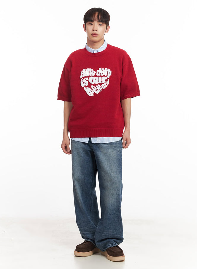 LEWKIN Men's Classic Wide-Fit Jeans IA521 in mid-blue, full-body front on model, wide-leg washed denim, paired with red graphic knit top and striped shirt layered underneath.