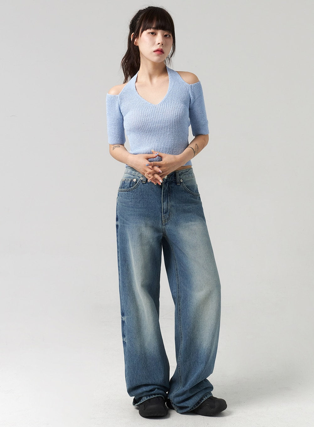 LEWKIN Mid-Wash Baggy Jeans CL312 in mid-wash blue, full-length front view on model, wide-fit cotton denim with faded wash, paired with blue cold-shoulder crop knit top.