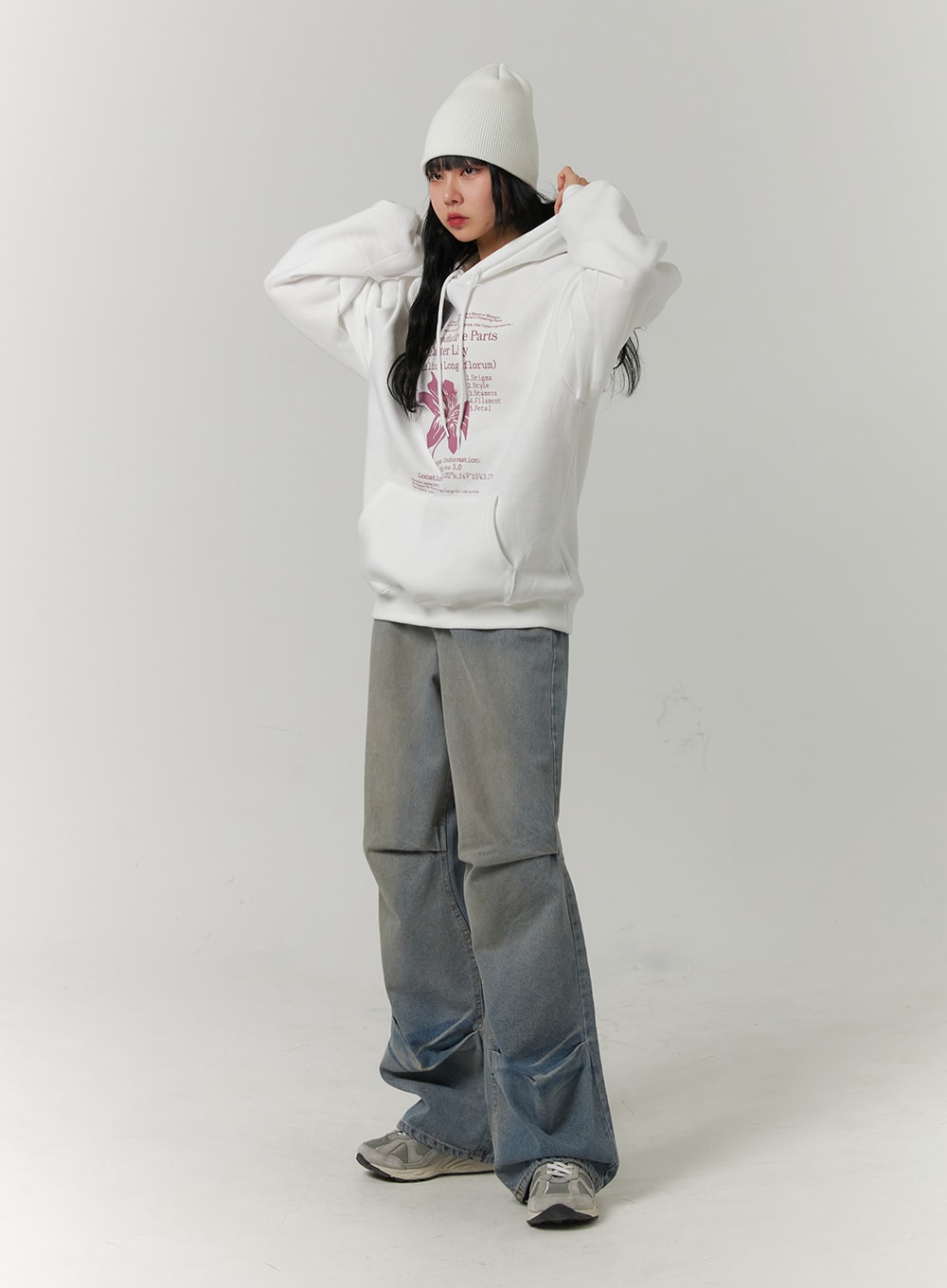LEWKIN Pintuck Washed Denim Wide-Leg Jeans CJ418 in blue, full-length front view on model, wide cotton denim with pintuck knee detail and gradient wash, styled with white graphic hoodie and beanie.