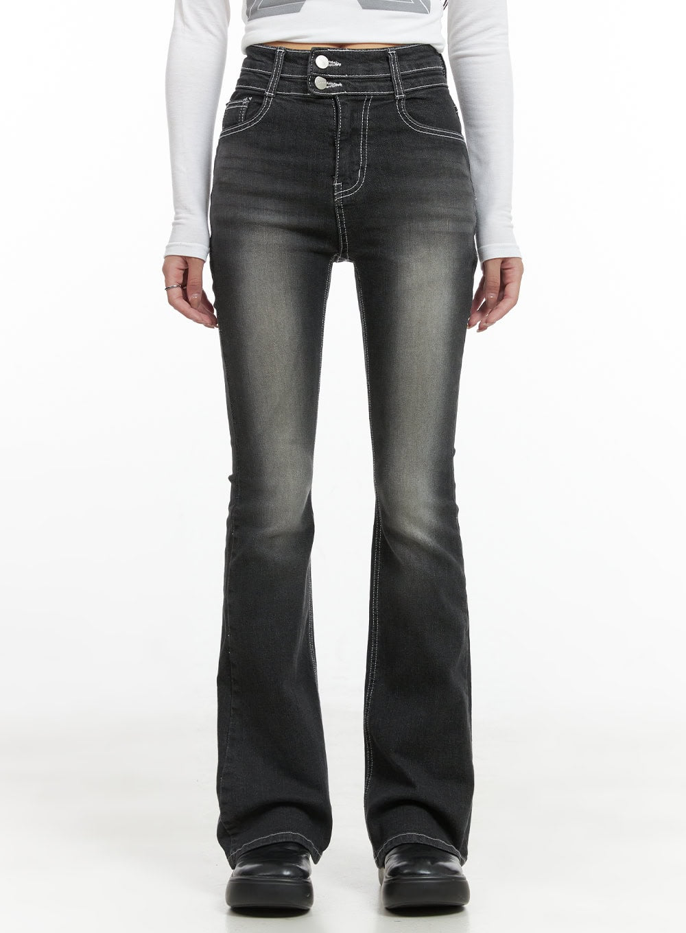 LEWKIN Gigi Two-Button Slim Bootcut Jeans CG421 in black, front full-length on model, high-waist washed denim with contrast white topstitching, slim bootcut flare, paired with white graphic long-sleeve top.