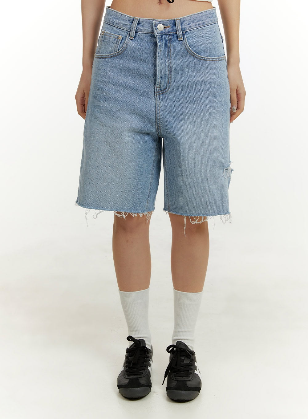LEWKIN Straight Leg Jorts CY408 in blue, front crop shot on model, wide-fit washed cotton denim with ripped knee detail and frayed raw hem, styled with white socks and black sneakers.