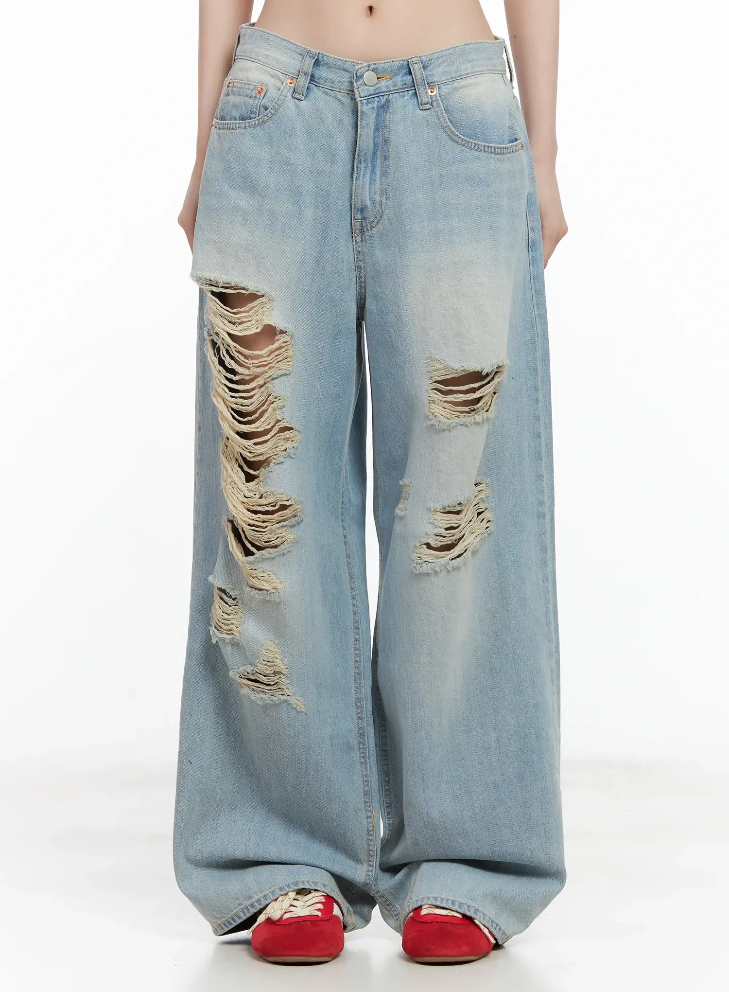 LEWKIN Gyuri Dirty-Wash Distressed Wide Jeans CU530 in blue, front product shot on model, heavy frayed rip detail at thighs, wide-leg cotton denim, paired with red sneakers.