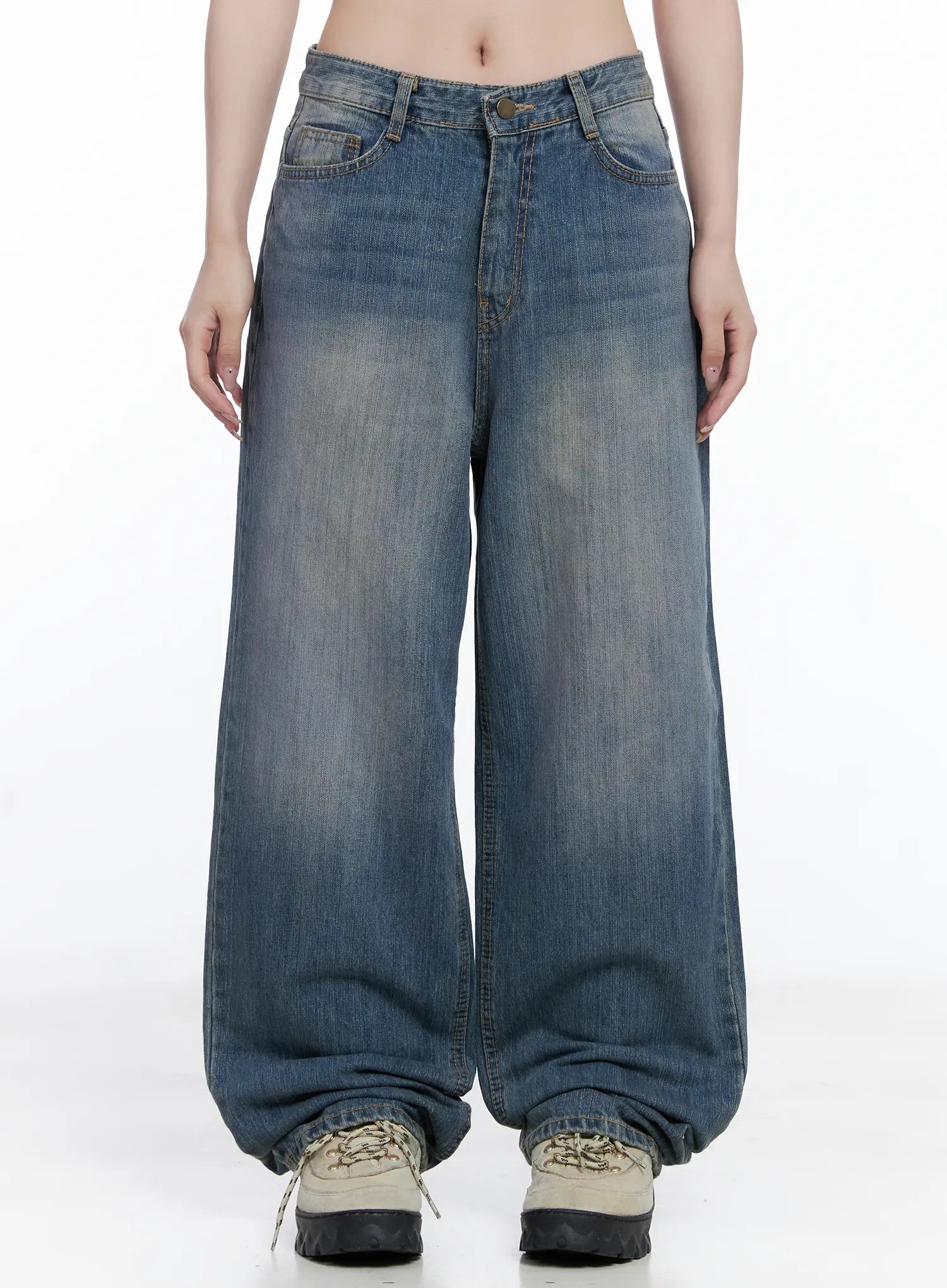 LEWKIN Lala Wide Leg Vintage Washed Jeans CG529 in blue, front view on model, low-rise wide-fit cotton denim with vintage wash, paired with chunky sneakers.