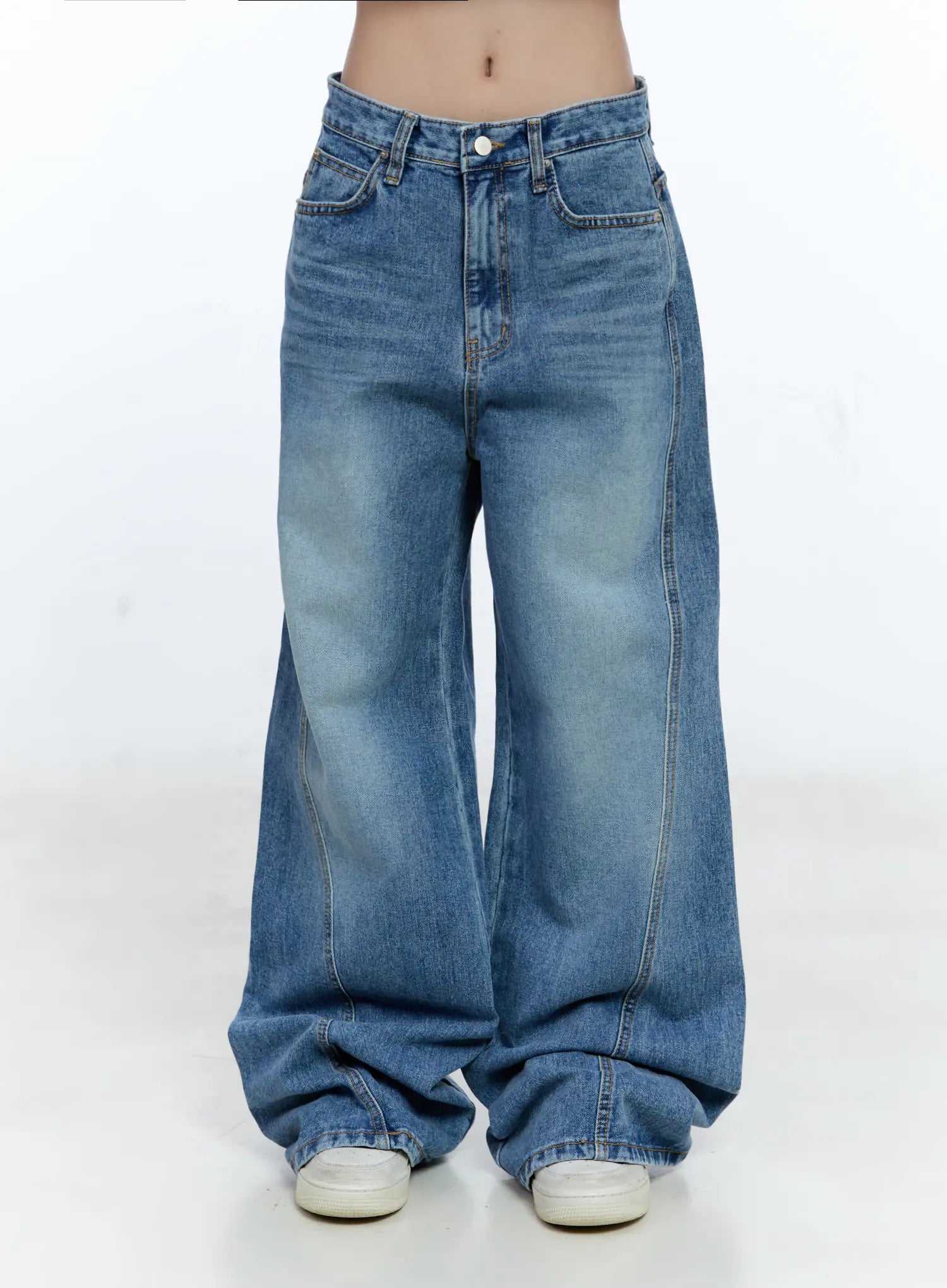 LEWKIN Ana Wide-Leg Denim Jeans CG507 in blue, front product shot on model from waist down, washed cotton wide-leg silhouette with front pockets and center seam, pooling at white sneakers.