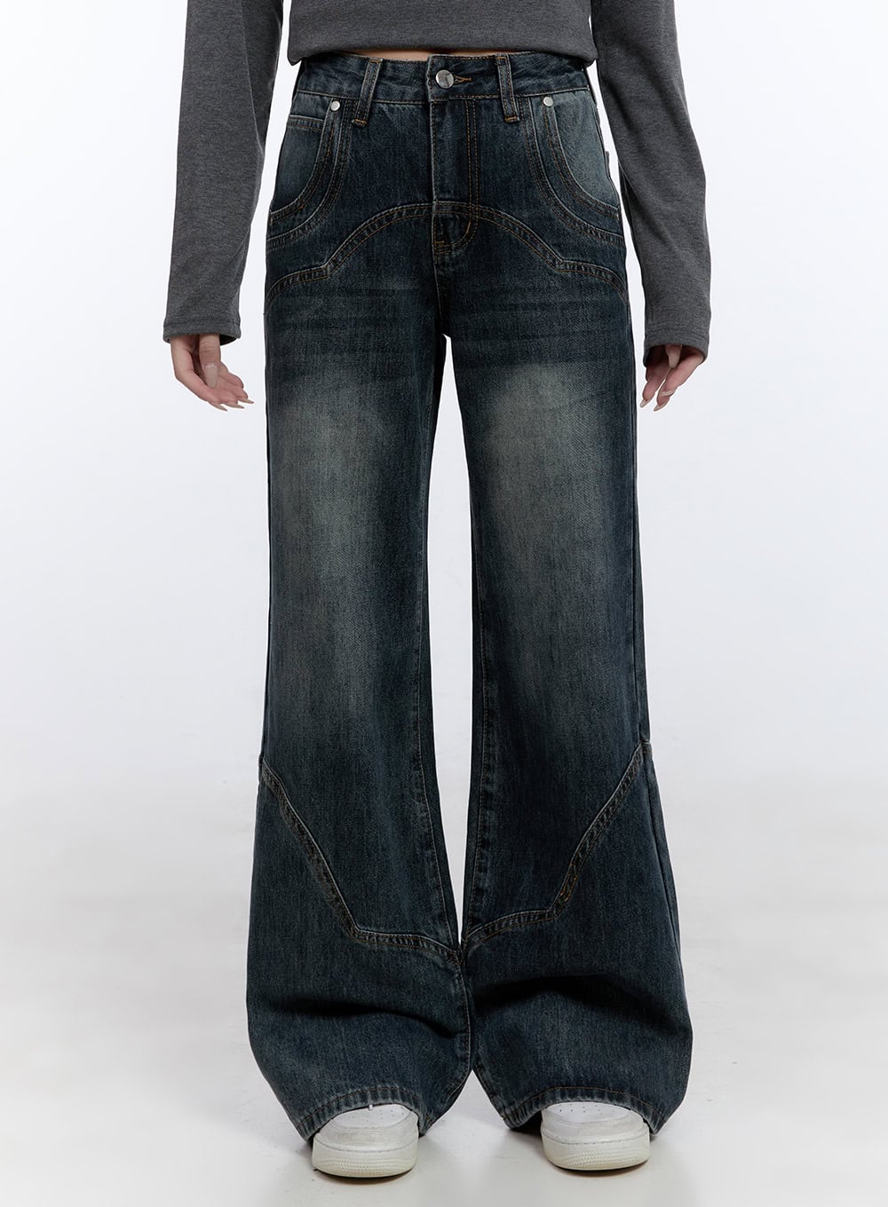 LEWKIN Barbara Washed Wide Leg Jeans CD420 in blue, front cropped view on model, washed cotton denim with decorative curved stitch panels, wide leg silhouette, paired with grey top.
