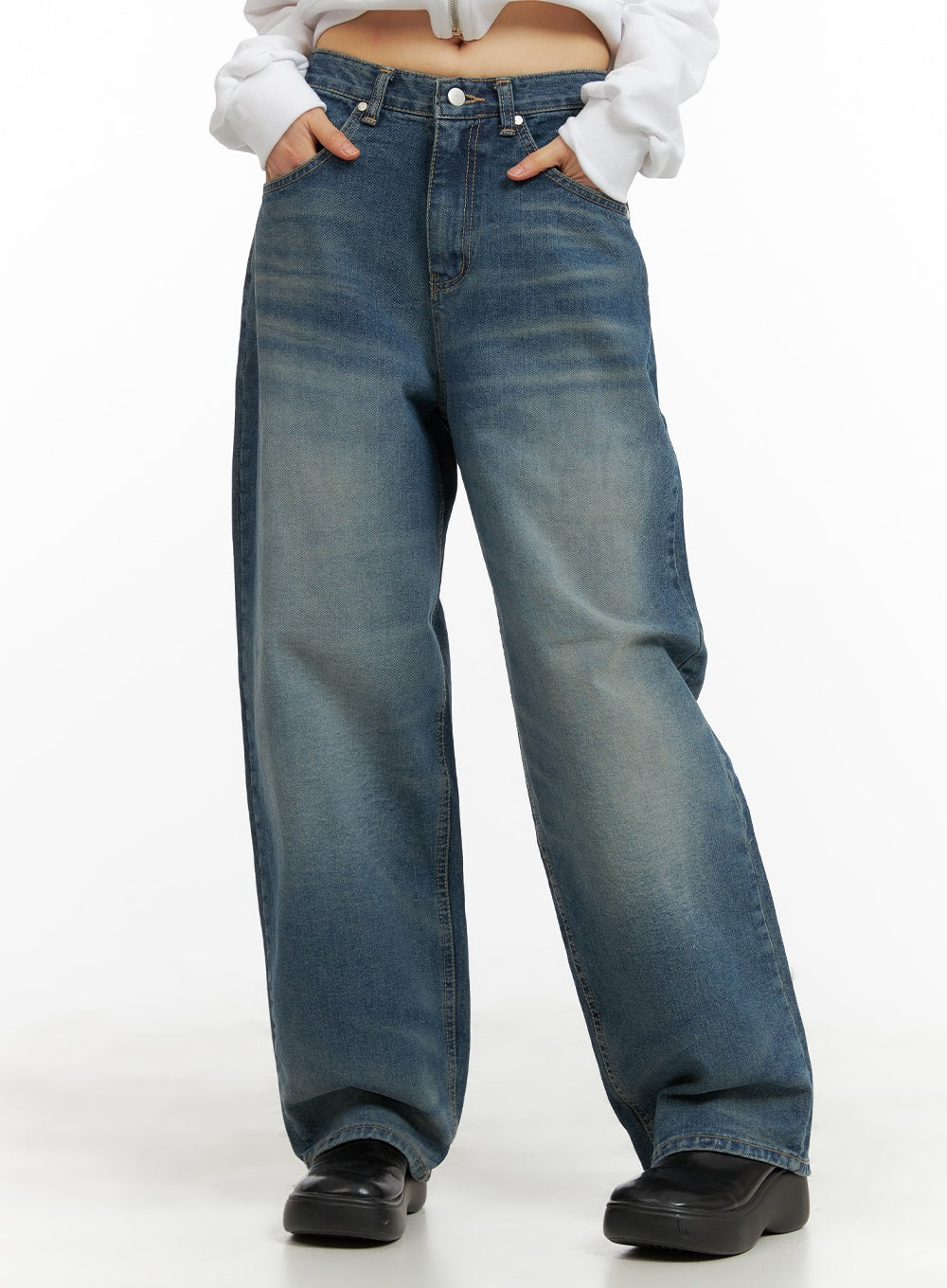 LEWKIN Washed Wide Leg Jeans CA419 in blue, front cropped view on model, wide-fit cotton denim with vintage wash fading, paired with white cropped top and black loafers.