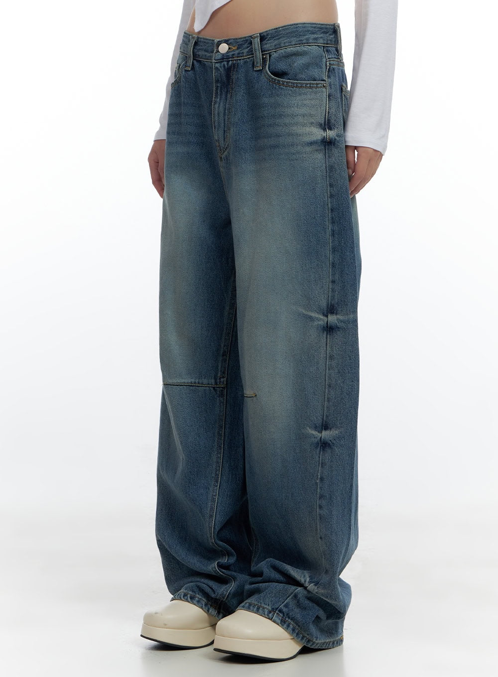 LEWKIN Aria Comfy Cotton Wide Leg Jeans CS420 in blue, side-angle close-up on model, washed cotton-denim baggy fit with pintuck seam detail, pooling hem over cream platform shoes.