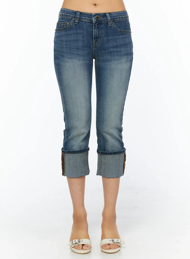 LEWKIN Rena Roll-Up Capri Jeans CU517 in blue, front product shot from waist down, tight-fit washed denim with wide roll-up cuff, paired with white heeled mule sandals.