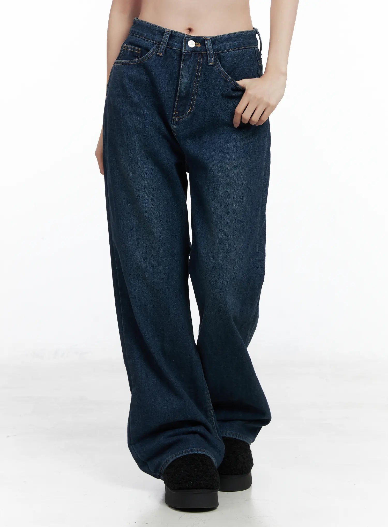LEWKIN Jordan Velvet Fleece Wide Jeans CN518 in blue, front cropped view on model, wide-fit washed cotton denim with contrast stitching and front pockets, hand in pocket pose.