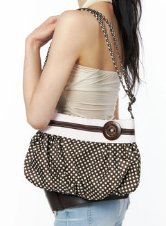 LEWKIN Polka Dot Button Detail Shoulder Bag CU511 in Brown, back view on model worn over shoulder, ruffled polka dot polyester body with white band and wooden button, styled with cream top and jeans.