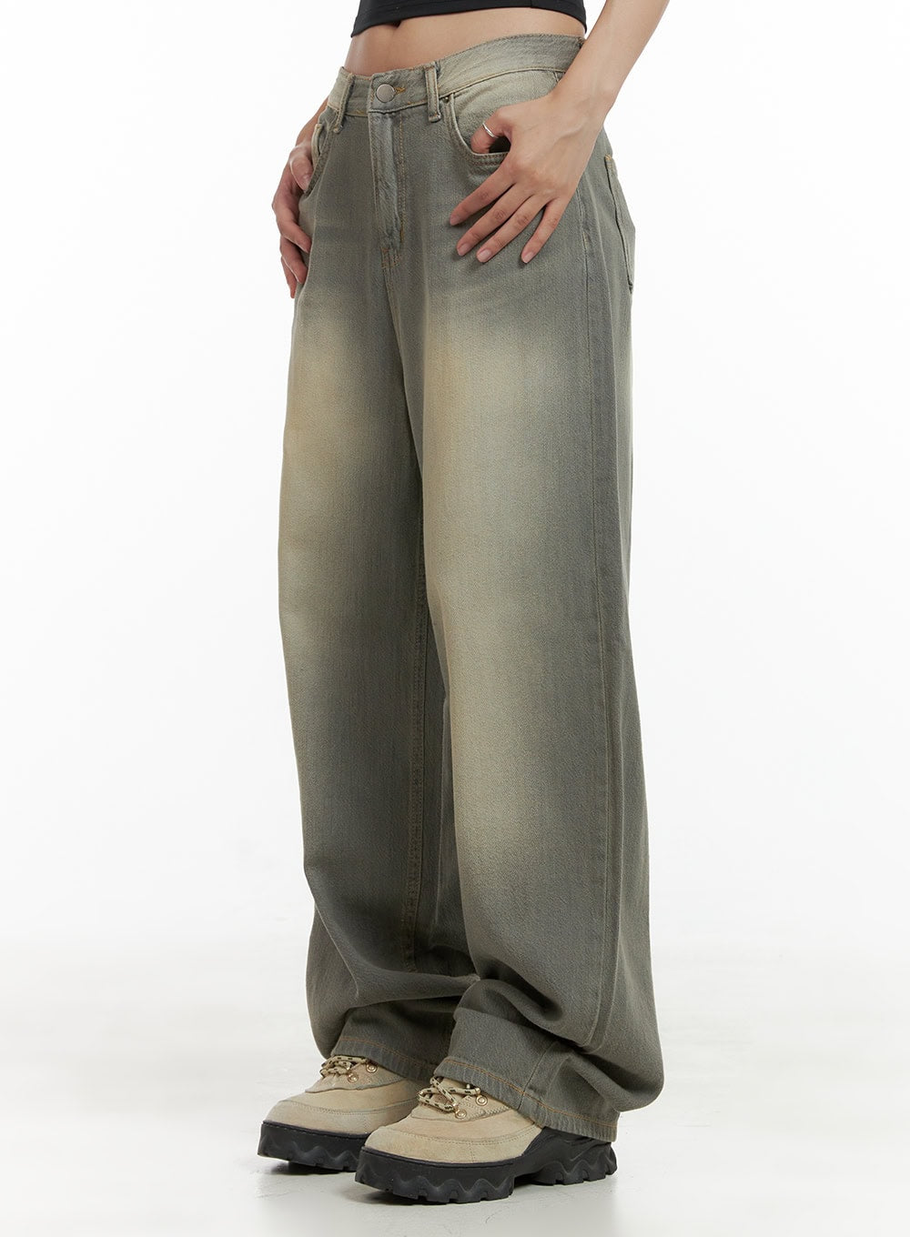 LEWKIN Washed Baggy Denim Jeans CU404 in Brown, side view on model, wide-fit cotton denim with sun-faded wash, low rise waistband, paired with chunky beige sneakers.