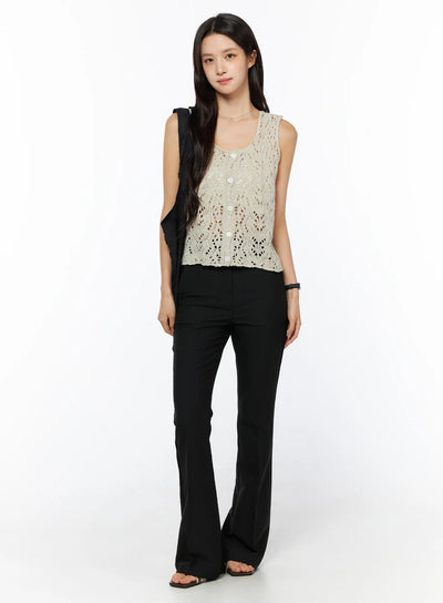LEWKIN Basic High-Waist Stretch Flared Slacks CU522 in black, full-length front view on model, high-rise waistband with flared hem, styled with cream crochet knit top and black tote bag.
