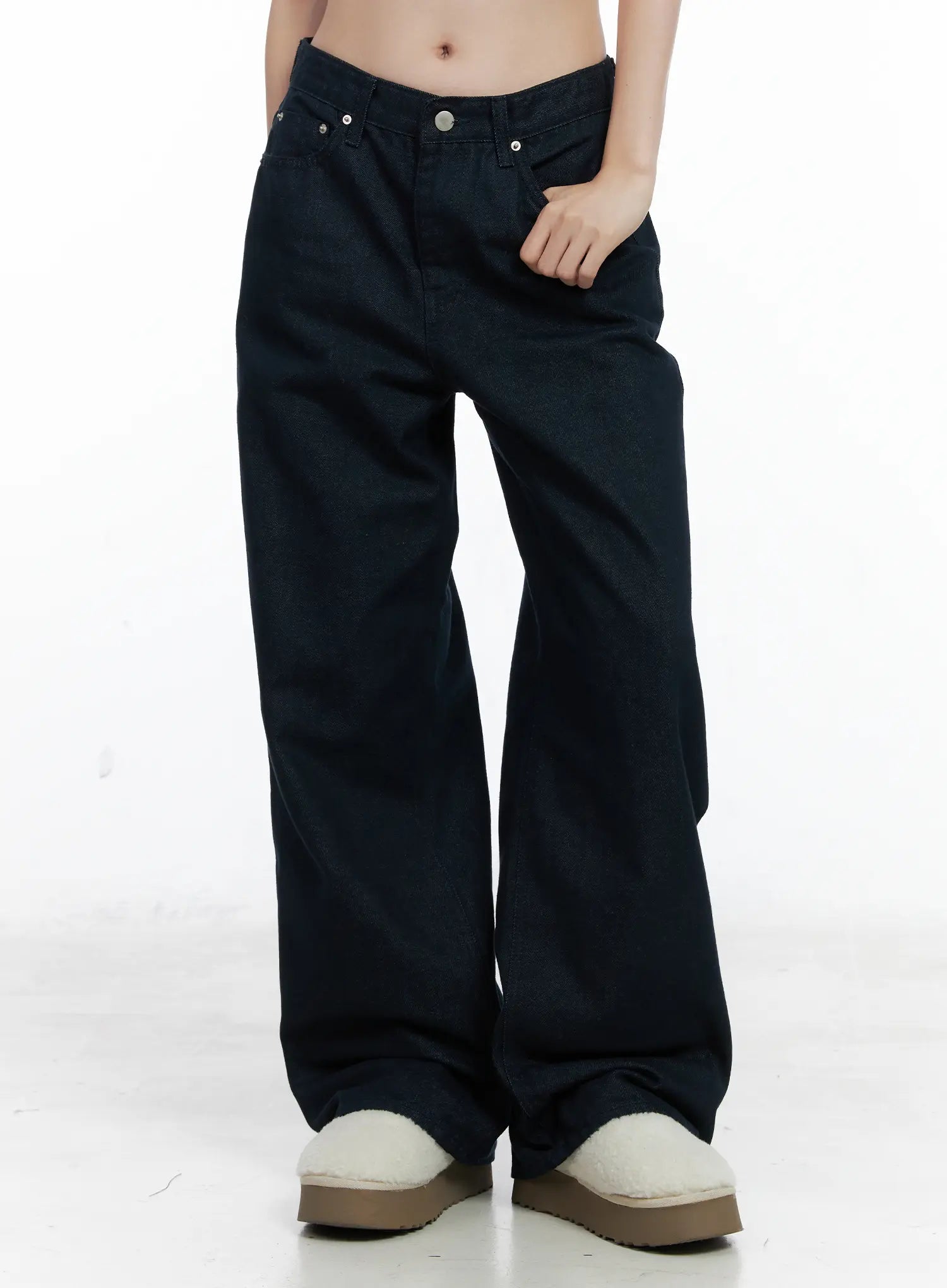 LEWKIN Drew Non-Fade Relaxed Fit Wide Jeans CN519 in dark blue, front angled view on model, low-rise cotton wide leg, hand in pocket, paired with shearling platform shoes.