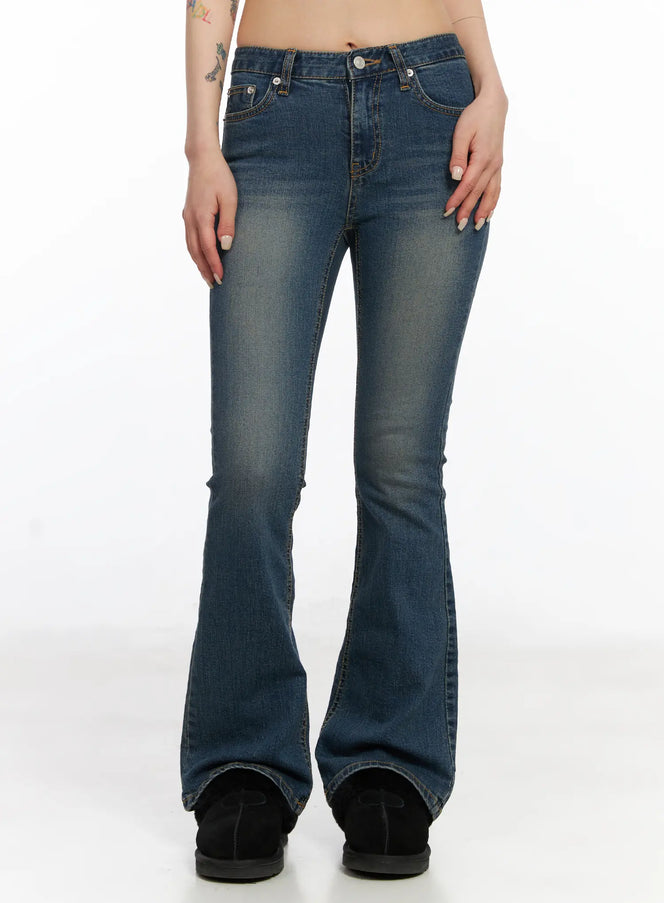 LEWKIN Azalea Washed Bootcut Flared Jeans CJ523 in dark blue, front view on model, skinny-fit bootcut silhouette with washed cotton-spandex denim and contrast stitching, worn with black shoes.