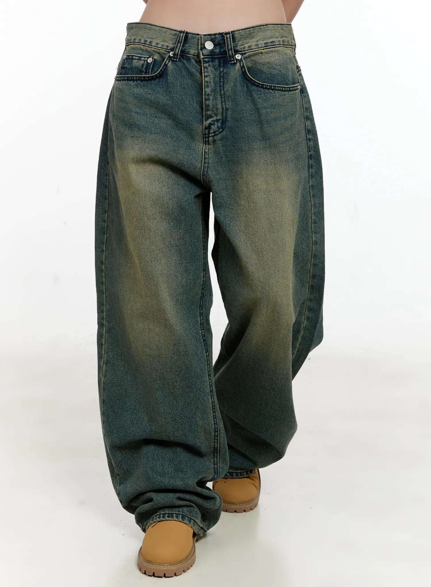 LEWKIN Sooyoung Baggy Vintage Wash Jeans CL531 in dark blue, front cropped view on model, wide-leg cotton denim with yellow-tinted vintage wash, paired with tan boots.